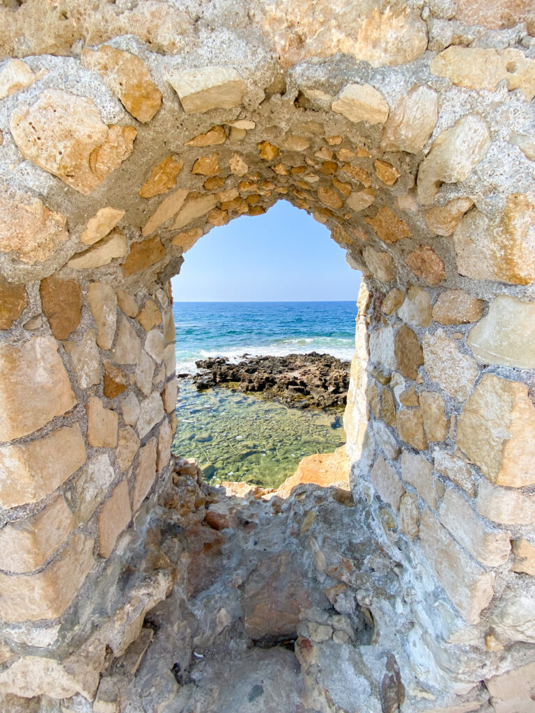 image of sea through Grecian fortification